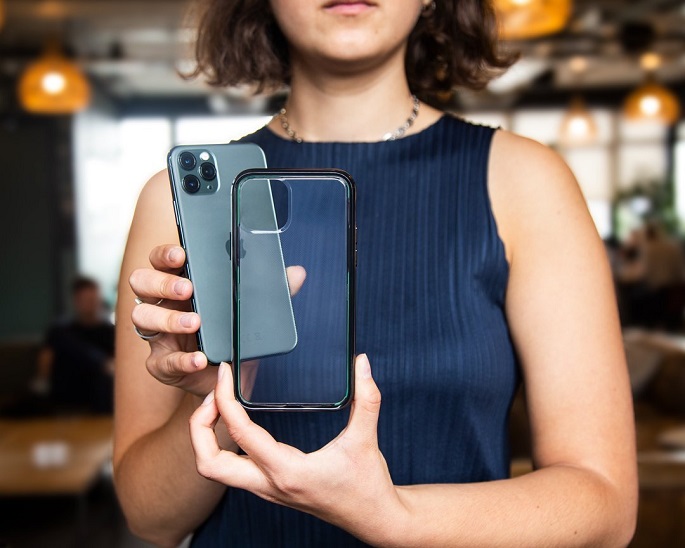 woman holding mobile phone and phone case