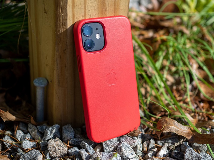 close-up of iphone with red protective case