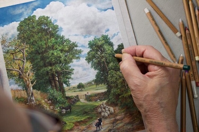 man painting nature with pastel pencils