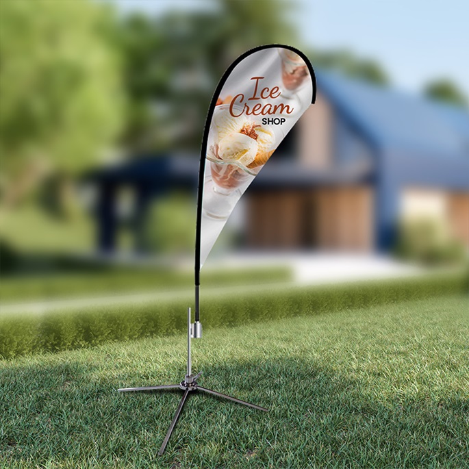 teardrop flag on a grass for an ice cream shop 