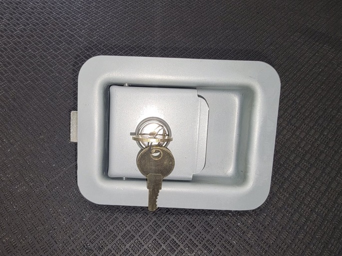 slam latch with lock on door