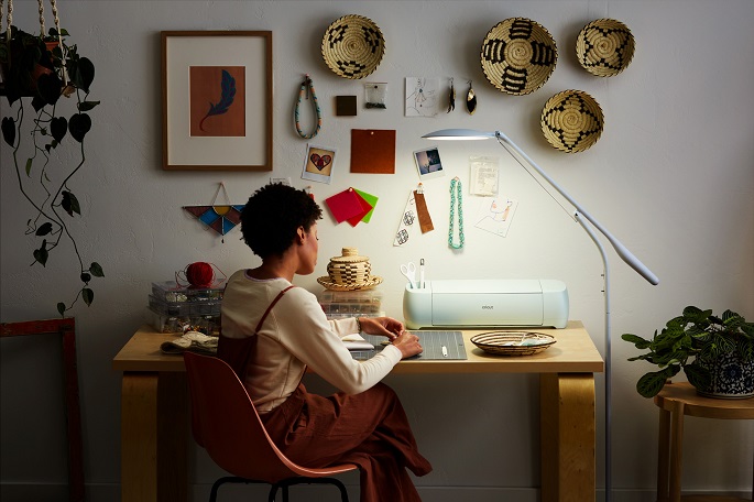 woman working under a craft light