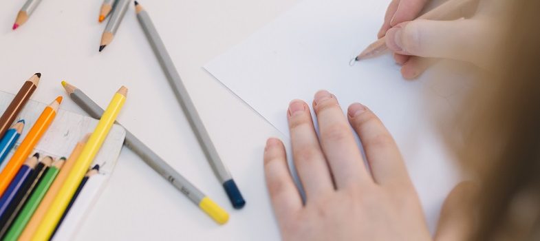 woman using colour pencils for drawing